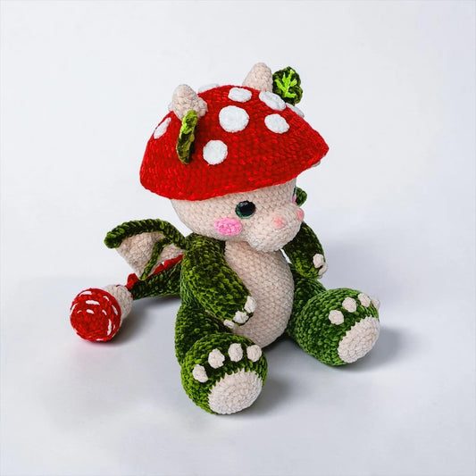 Baby Mushroom Dragon crochet pattern with a cozy woodland dragon, red mushroom cap, soft wings, and green body