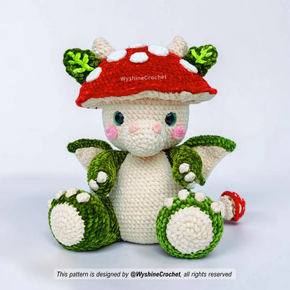 Cute baby mushroom dragon amigurumi with leaf ears, tiny horns, soft wings, and magical woodland details