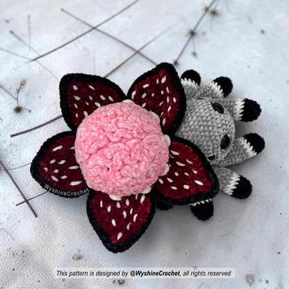 Amigurumi Halloween crochet pattern for a spooky cute plushie spider with brain flower decoration and handmade fall decor charm
