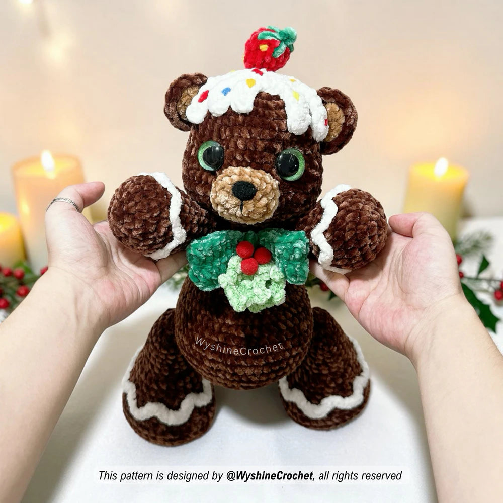 Handmade gingerbread bear amigurumi with festive frosting design, perfect for Christmas decor and crochet market prep
