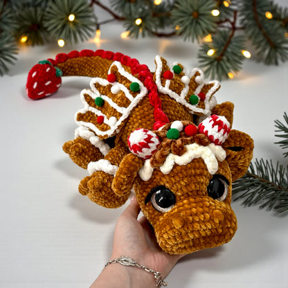 Gingerbread Dragon Crochet Pattern finished Christmas amigurumi plushie with icing details, candy-striped horns, and festive holiday charm