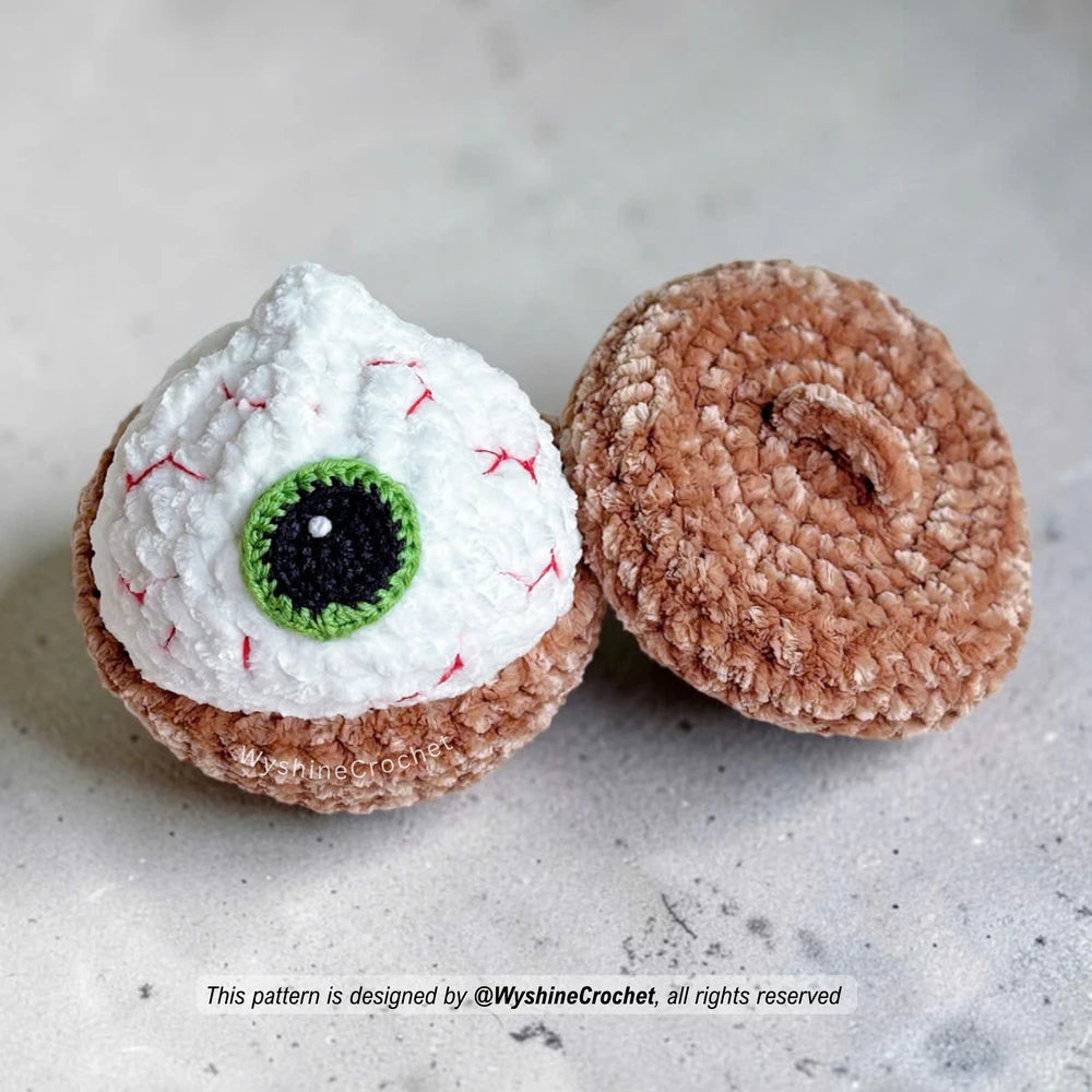 Eye Ball Dumpling crochet pattern with crochet eye detail and embroidered red blood vessels for spooky Halloween decor