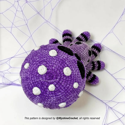 Poisoned Mushroom Spider crochet plushie close-up showing skull-style mushroom cap, glaze drips, white dots, and creepy cute Halloween details