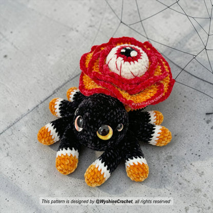 Spooky cute flower spider crochet pattern PDF featuring a rose-shaped body, watchful eye, eight legs, and Halloween amigurumi charm
