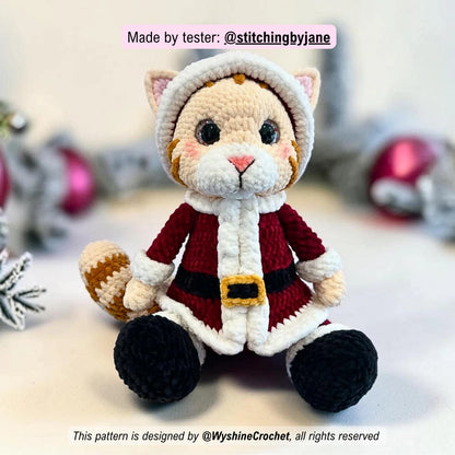 Tester-made Santa Cat crochet plushie showing a handmade Christmas cat amigurumi variation with festive holiday charm