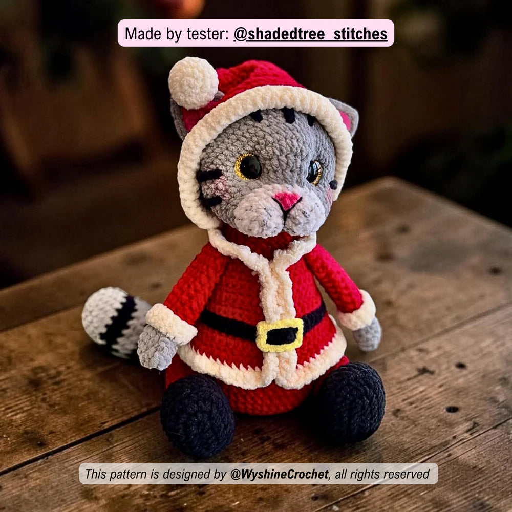 Tester-made Santa Cat crochet plushie showing a handmade Christmas cat amigurumi variation with festive holiday charm