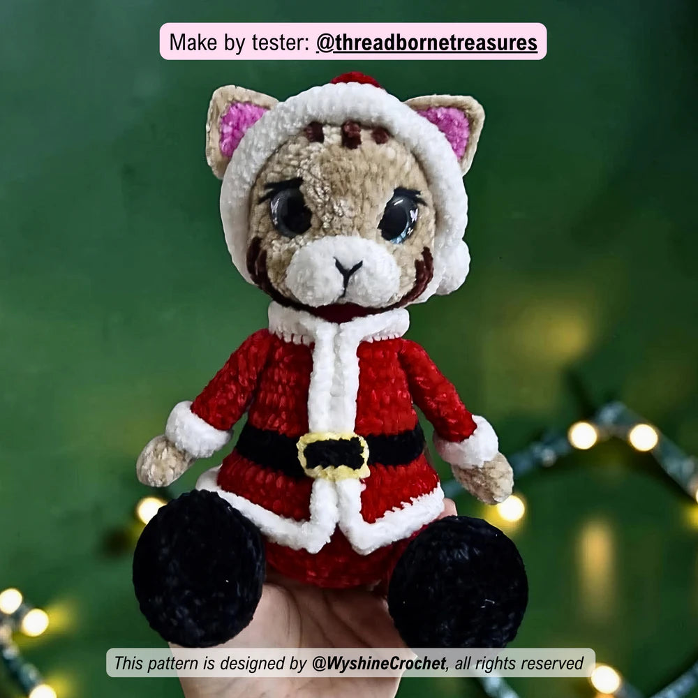 Tester-made Santa Cat crochet plushie showing a handmade Christmas cat amigurumi variation with festive holiday charm