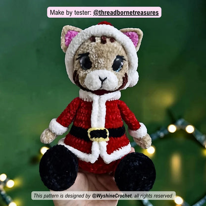 Tester-made Santa Cat crochet plushie showing a handmade Christmas cat amigurumi variation with festive holiday charm
