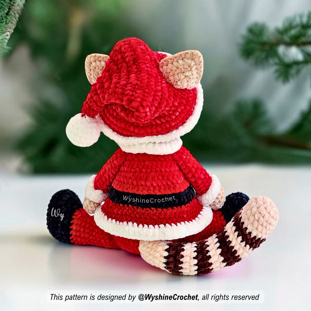Christmas cat crochet pattern featuring a festive Santa Claus kitty with a red coat, matching hat, and striped tail